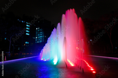 Beautiful view of a colorful water fountain  inside the magical water circuit in Lima  one of the largest existing water theme parks. Lima Peru