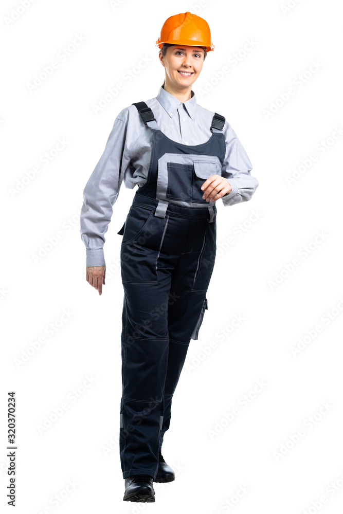 Woman builder engineer in full growth steps forward. Isolated Woman builder engineer in full growth steps forward. Isolated
