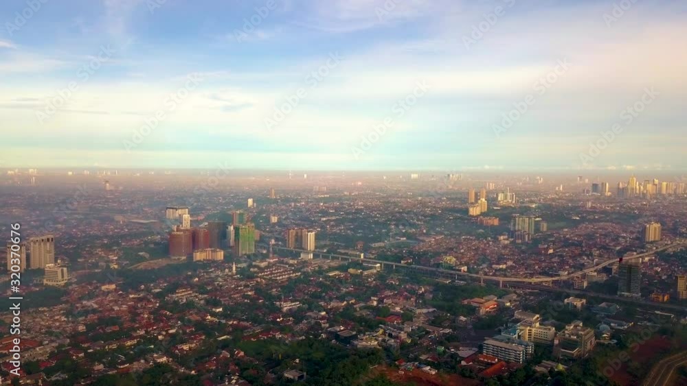 custom made wallpaper toronto digitalBirds view of buildings around Cilandak, Jakarta. A drone footage in the morning with cityscapes and mountains view