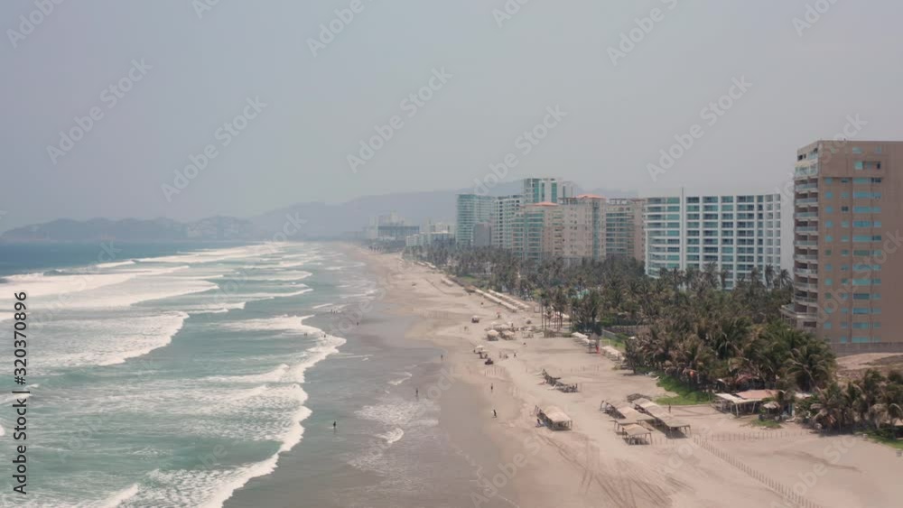 Acapulco Beachfront, Mexico, Aerial View of Misty Skyline, Beach and Luxury Apartment Buildings in Famous Resort City Acapulco Beachfront, Mexico, Aerial View of Misty Skyline, Beach and Luxury Apartment Buildings in Famous Resort City