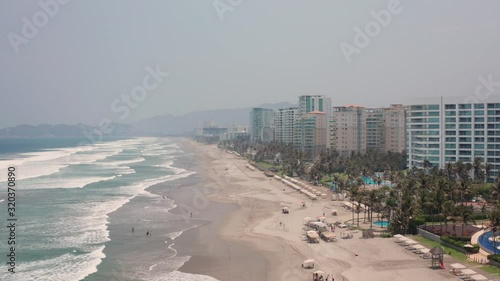 Famous Holiday Destination, Aerial View of Acapulco Beach, Mexico, Condomium and Apartment Buildings and Scenic Ocean Waves photo