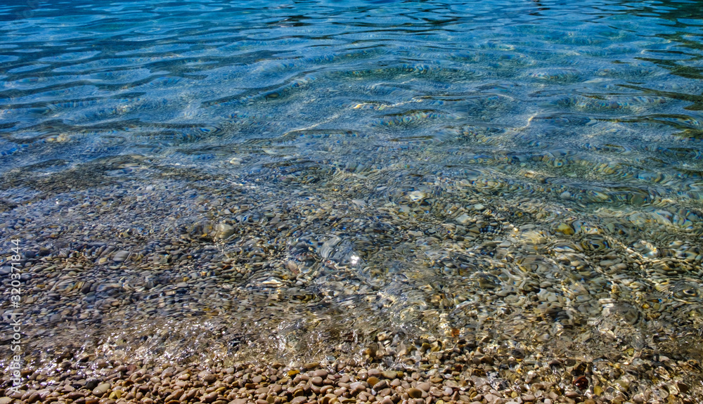 Oludeniz, Turkey. Blue Lagoon. Stones and small pebbles in the transparent sea