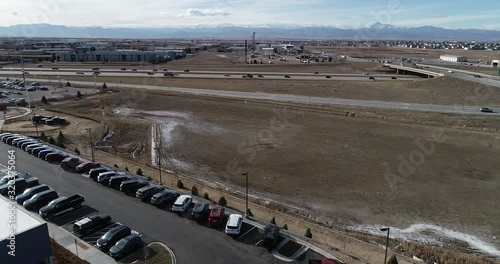 A drone flight toward I25 in Colorado with the mountains in the distance. photo