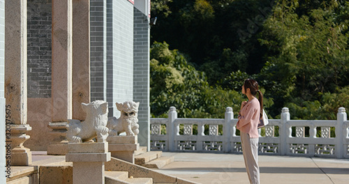 Woman visit chinese temple in Hong Kong photo