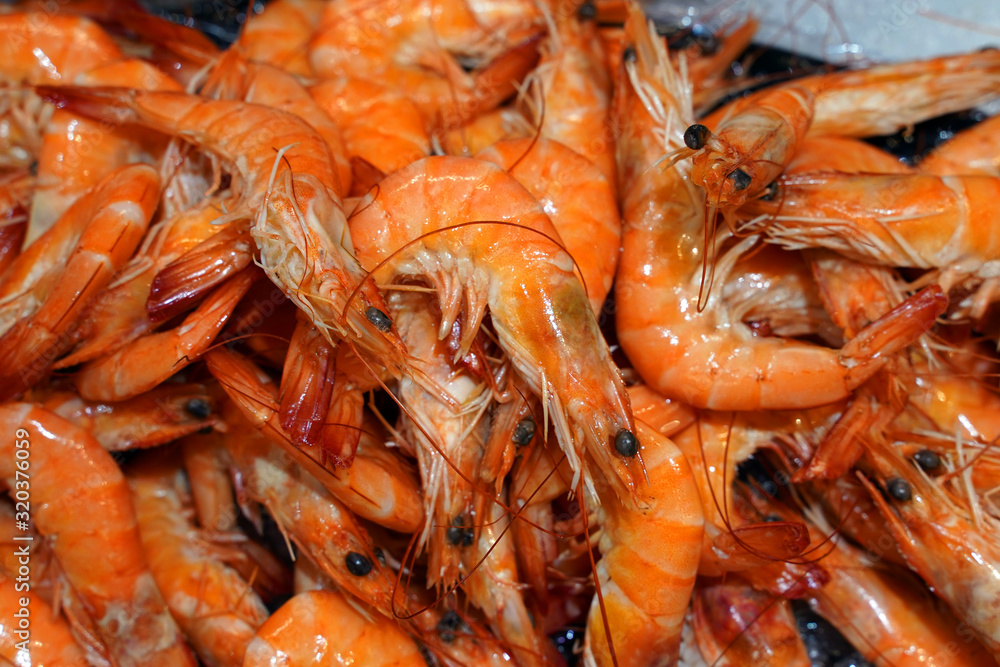 Delicious fresh shrimps on ice. Selective focus Delicious fresh shrimps on ice. Selective focus