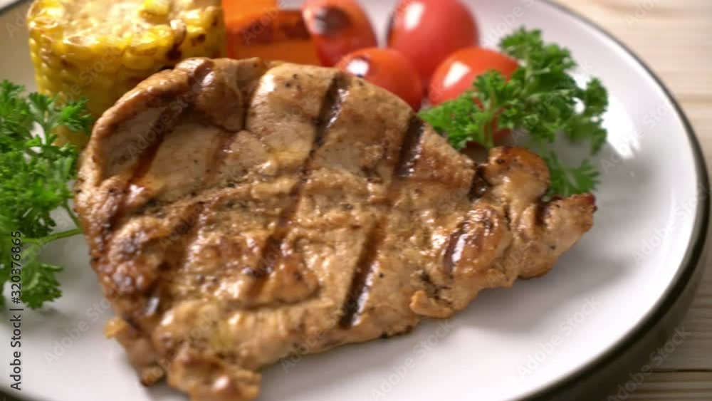 grilled and barbecue fillet pork steak with corn, carrot and tomatoes grilled and barbecue fillet pork steak with corn, carrot and tomatoes
