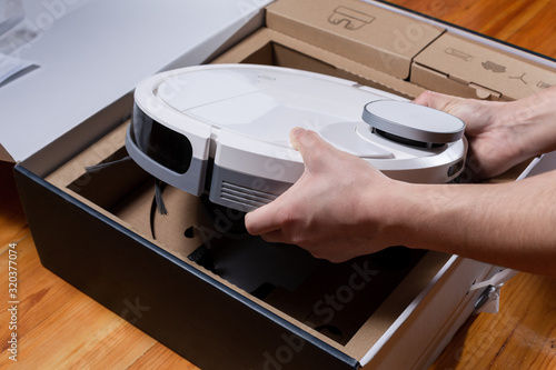 New robotic vacuum cleaner in a cardboard box