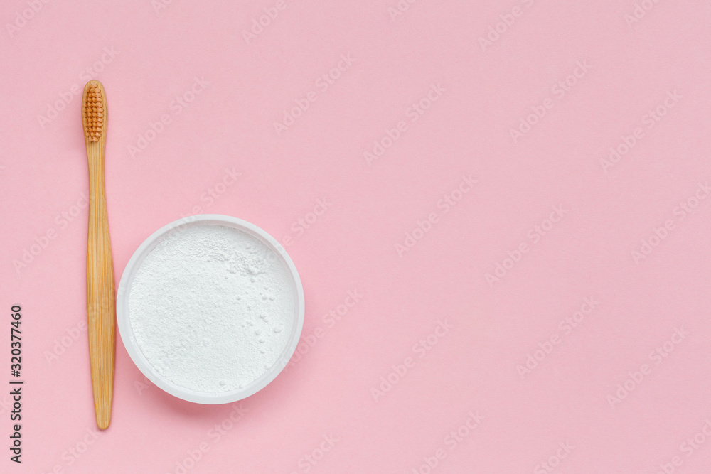 plastic less lifestyle, eco friendly tooth brush and natural powder toothpaste isolated on pastel pink background, flat layout, copy space plastic less lifestyle, eco friendly tooth brush and natural powder toothpaste isolated on pastel pink background, flat layout, copy space