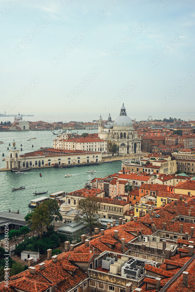 View from Campanile di San Marco to Grand Canal and Basilica di Santa Maria della Salute at summer sunny day in Venice, Italy