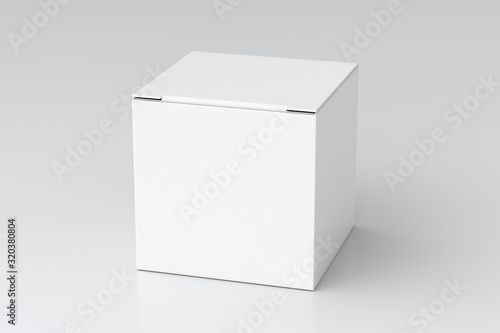 Foto Blank white cube gift box with closed hinged flap lid on white background