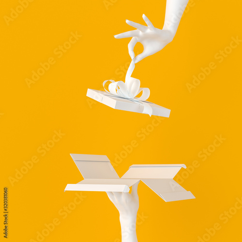 Fotografija White gift inside presenting banner - opening gift box and unwrapping white hand
