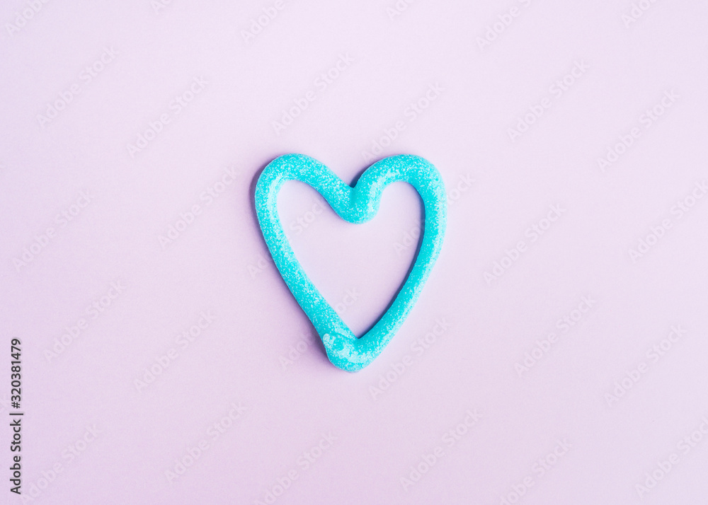 Heart shaped toothpaste line on pink