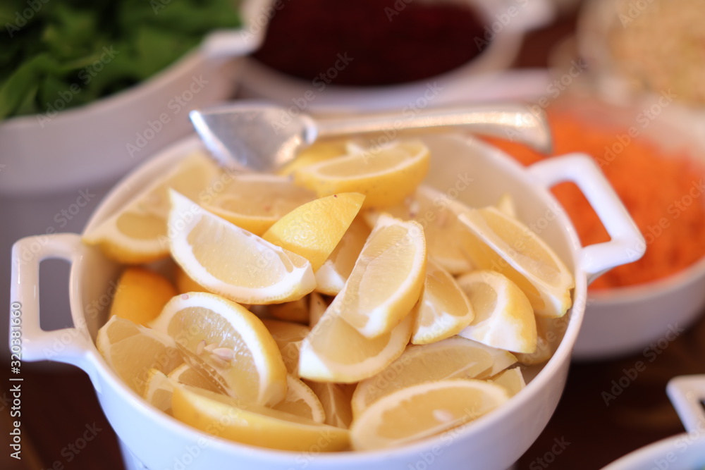 sliced lemons in a bowl sliced lemons in a bowl