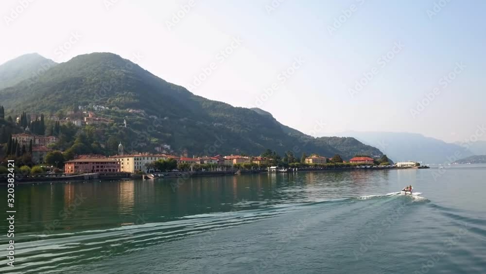 Colourful houses in hazy sunshine on the hills along Lake Como, Italy. Colourful houses in hazy sunshine on the hills along Lake Como, Italy.