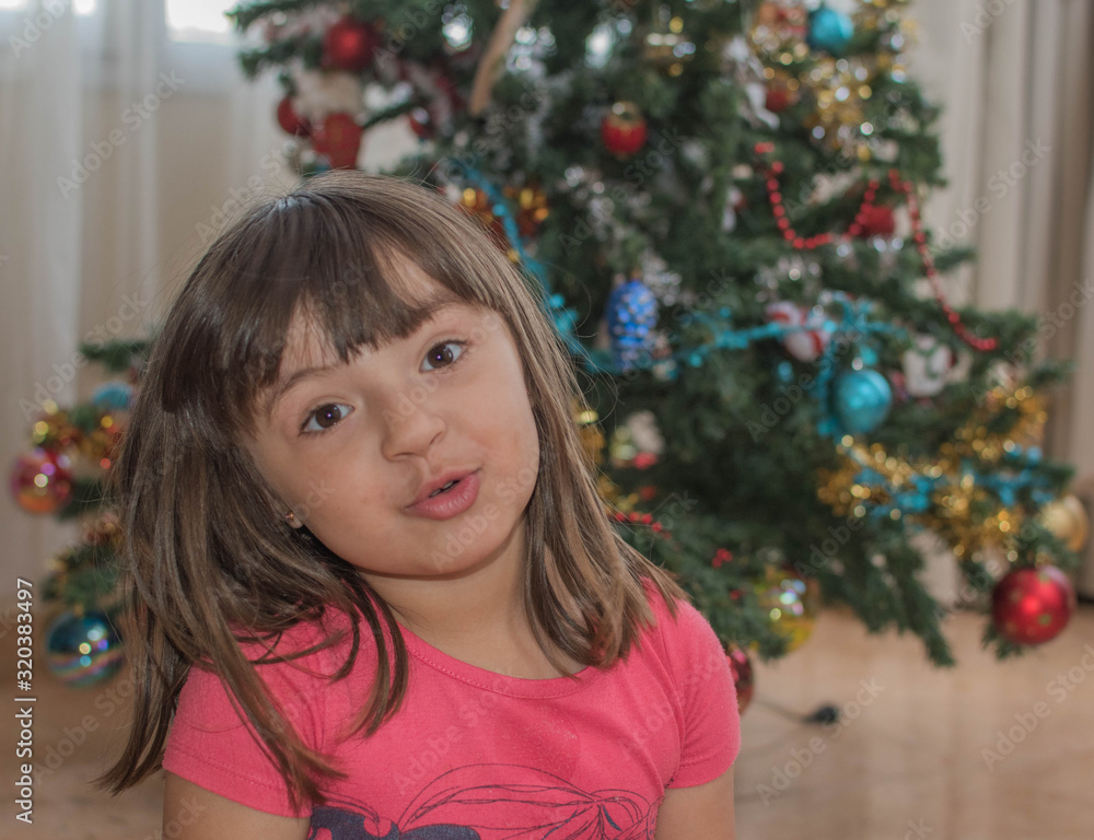Little girl smiles and plays in Christmas Little girl smiles and plays in Christmas