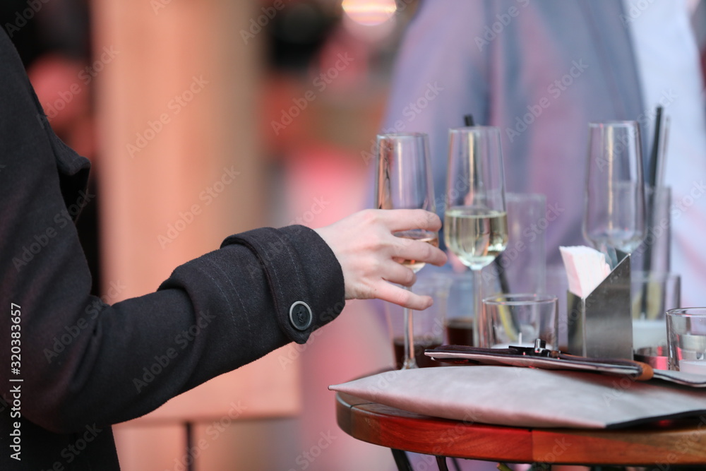 close up woman hands holding champaign glass