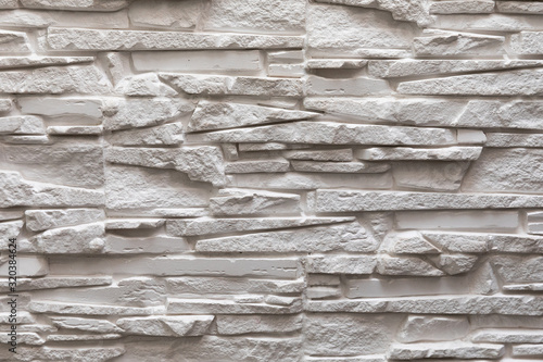 Photography close-up of ivory deep carved concrete wall