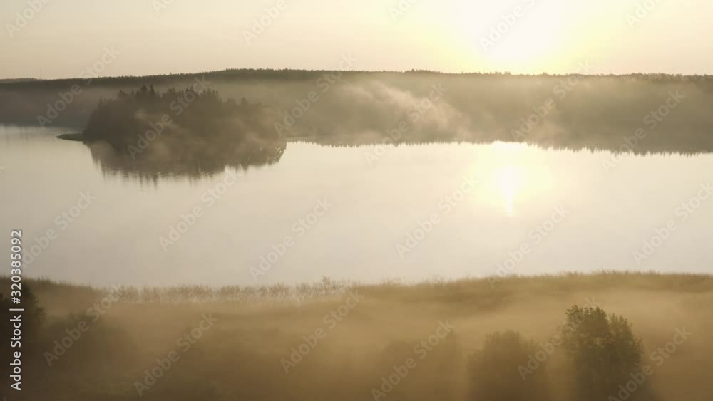 Aerial: Misty Sunrise above Scandinavian Landscape with Lake and Forest Aerial: Misty Sunrise above Scandinavian Landscape with Lake and Forest