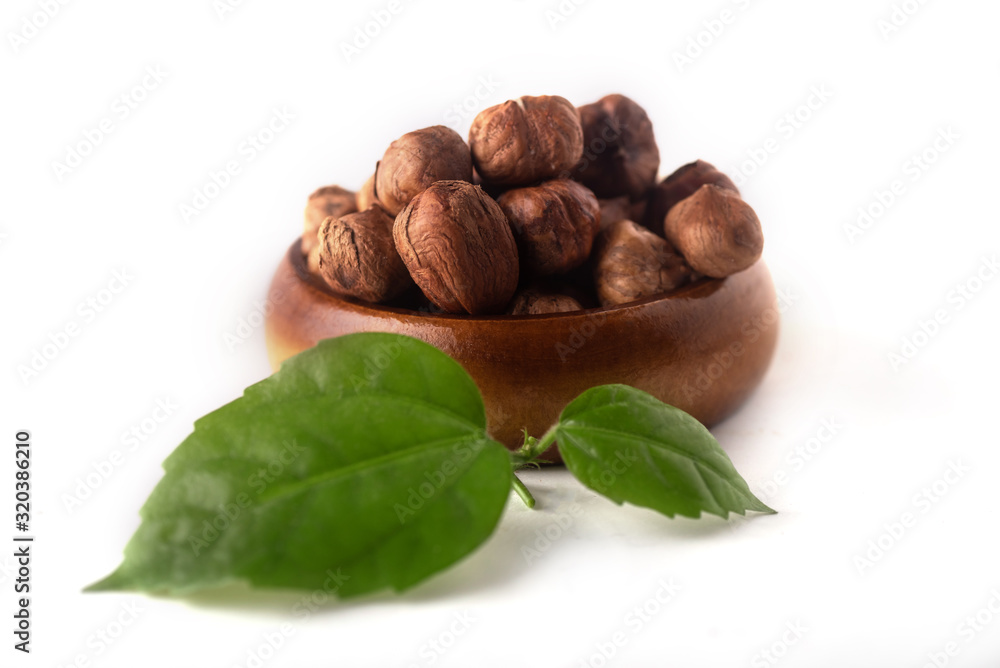 hazelnuts with leaves isolated on white background hazelnuts with leaves isolated on white background