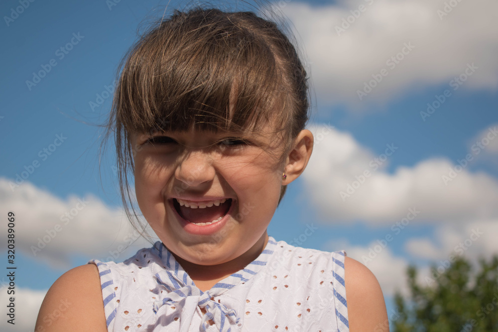 A little happy girl playing