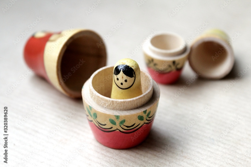 Photo Art Print Wooden Russian matryoshka dolls in folk style girls with painted dresses and veiled heads covered with babushka shawl Catherine Zibo