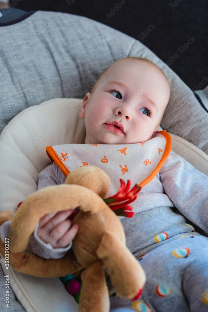 Young boy resting in the swing