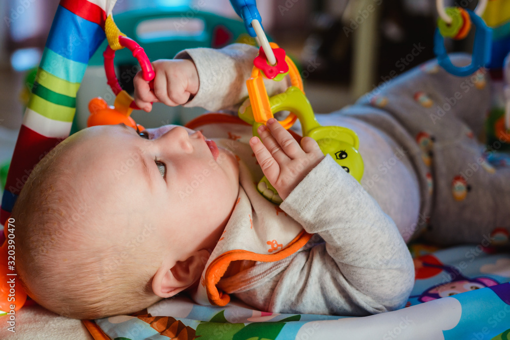 Young boy playing with toys.