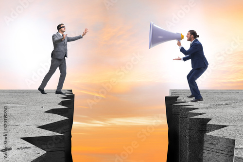 Canvas Print Businessman shouting with loudspeaker at others