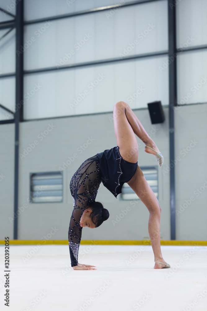 Gymnast training at the gym Gymnast training at the gym