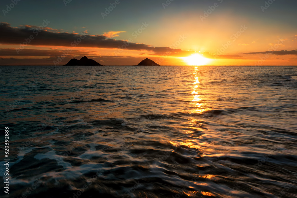 Obraz premium Sunrise scene at Lanikai Beach in Kailua, Hawaii. Lanikai is regularly ranked among the top beaches in the world