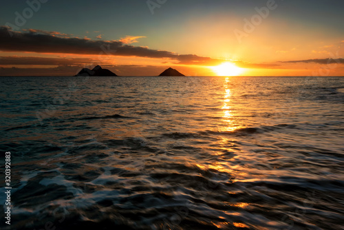 Sunrise scene at Lanikai Beach in Kailua  Hawaii.  Lanikai is regularly ranked among the top beaches in the world