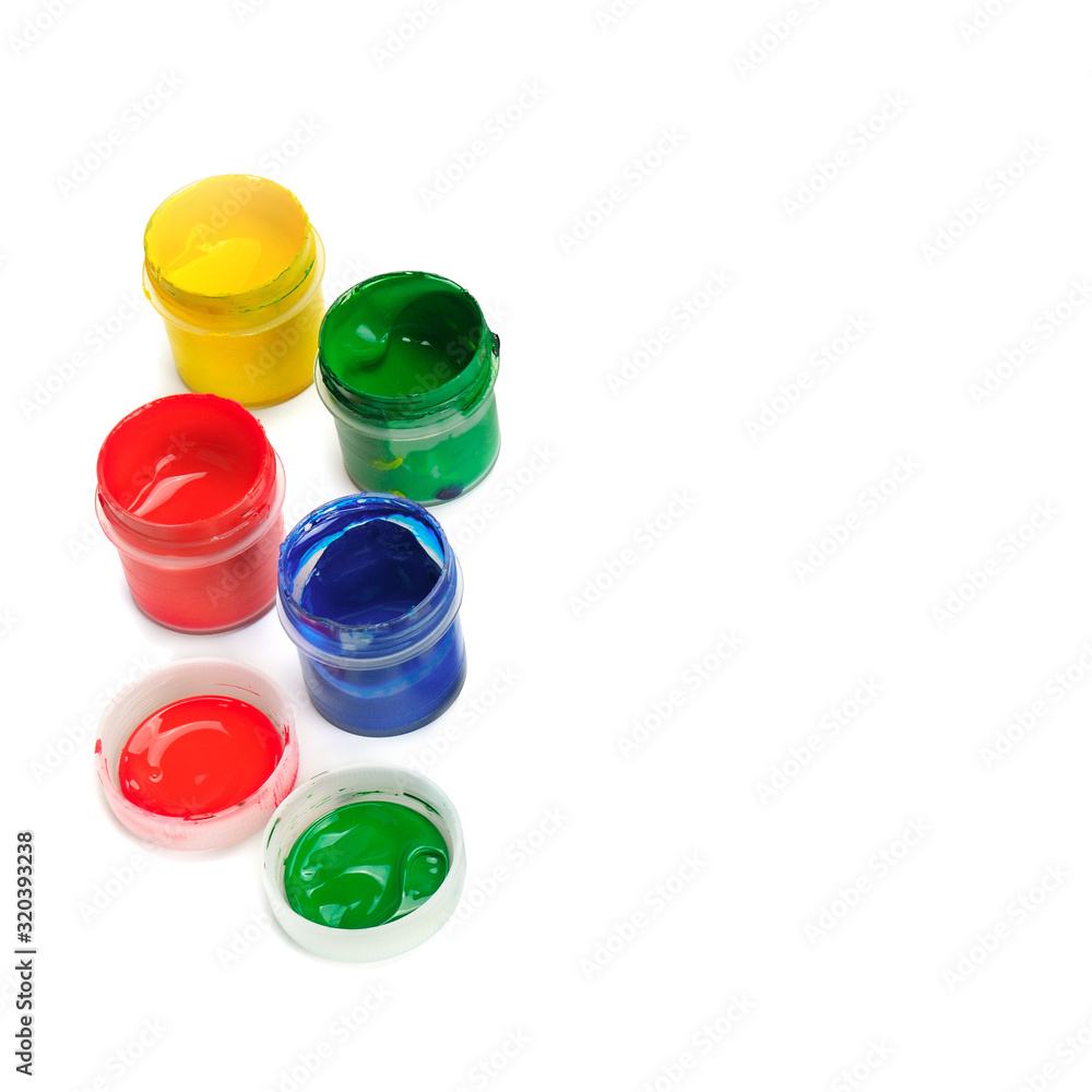 Jars with acrylic paint on a white background. Free space for text. Jars with acrylic paint on a white background. Free space for text.