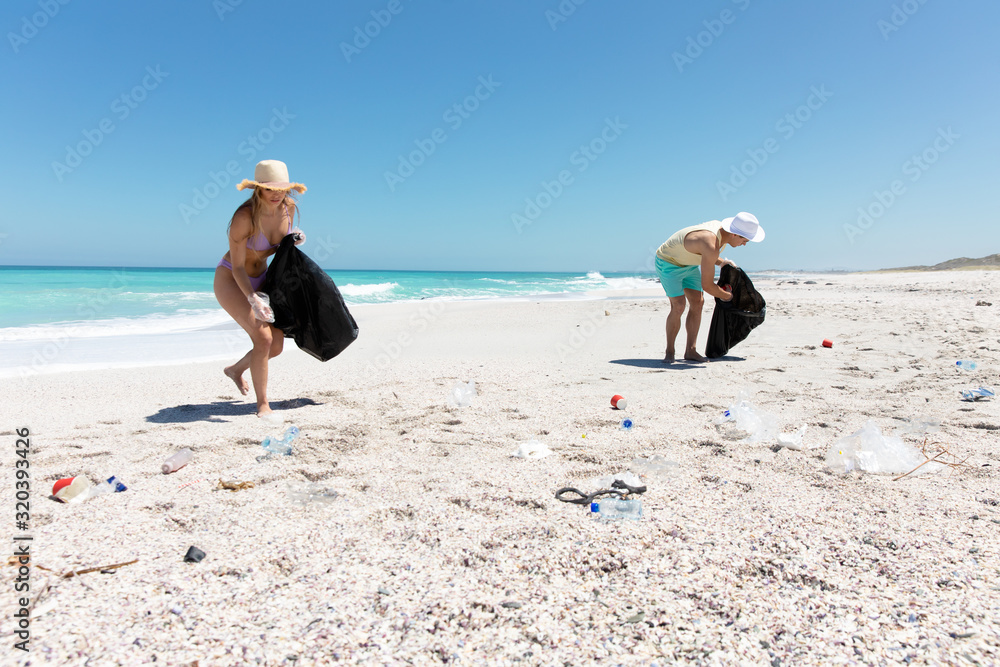 Young couple picking up the rubbish Young couple picking up the rubbish
