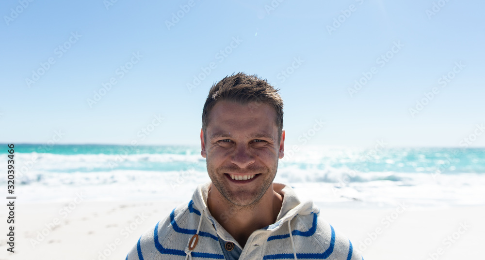 Man smiling at the beach