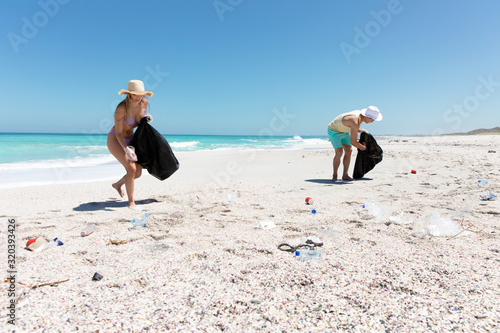 Young couple picking up the rubbish