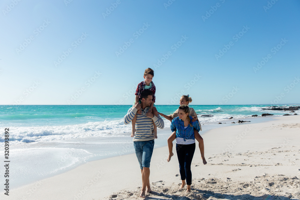 Parents and children having fun at the beach