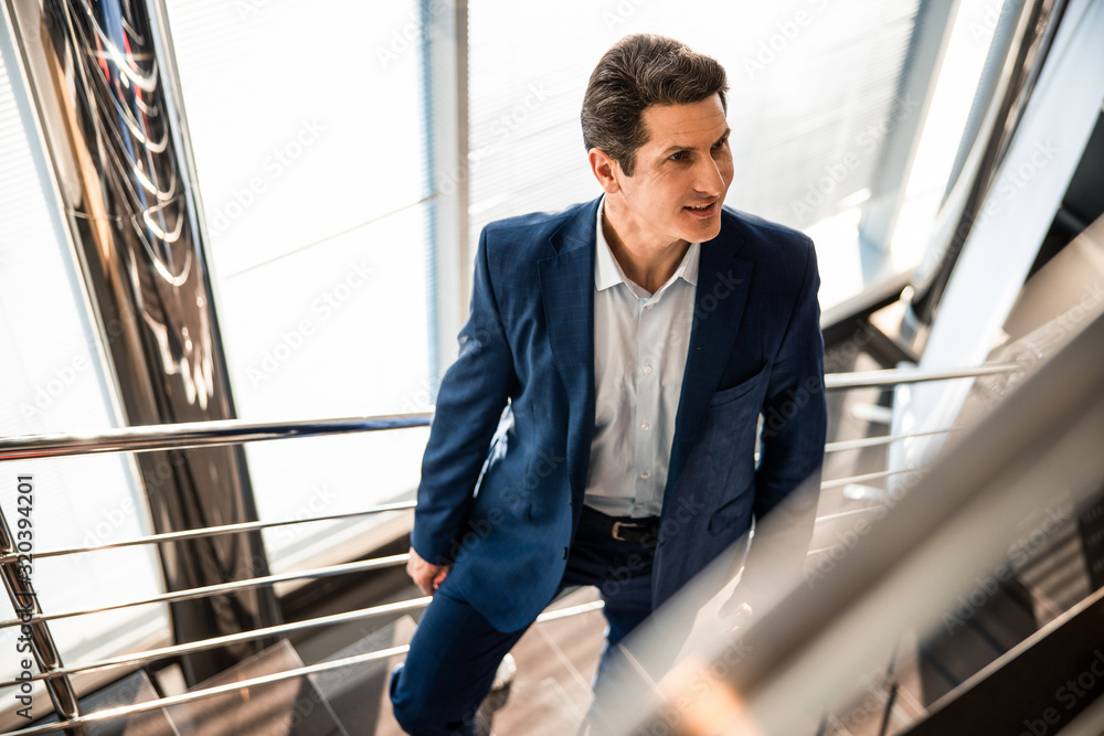 Smiling stylish man looking into the distance Smiling stylish man looking into the distance