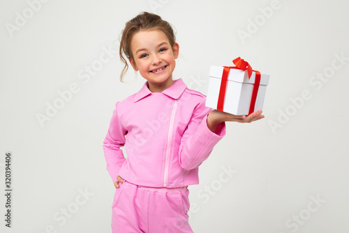 happy girl received a gift for Valentine's day on a white background with copy space © Ivan Traimak
