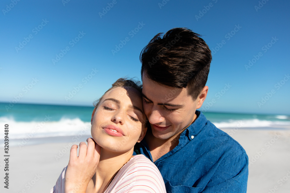Fototapeta premium Young couple in love at the beach