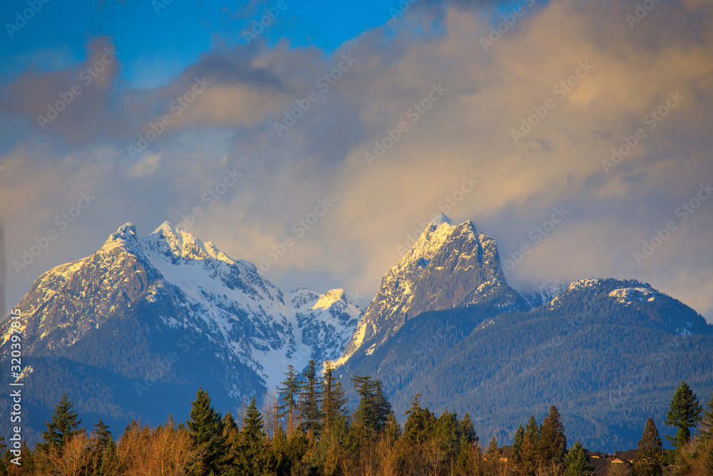 Sunset hitting snow covered mountains Sunset hitting snow covered mountains