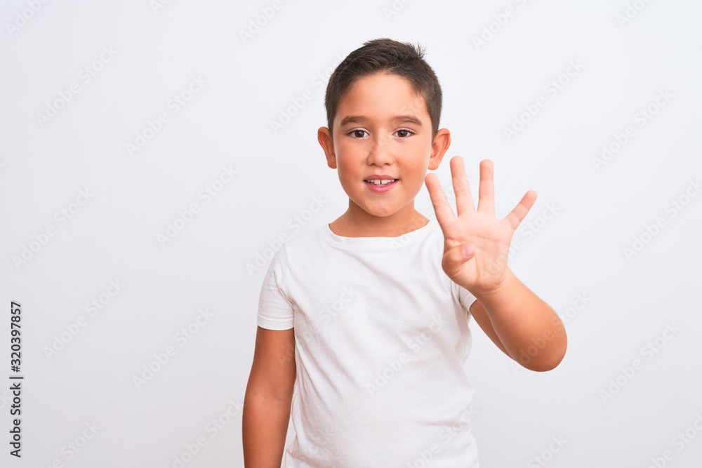 Beautiful kid boy wearing casual t-shirt standing over isolated white background showing and pointing up with fingers number four while smiling confident and happy. Beautiful kid boy wearing casual t-shirt standing over isolated white background showing and pointing up with fingers number four while smiling confident and happy.
