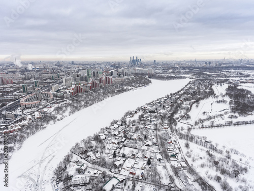 Moscow in winter and a village near the river, Russia. Aerial