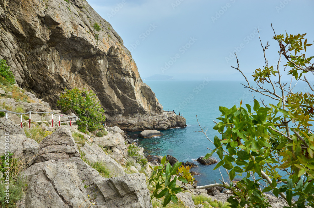 Tourist route along the trail in the mountains of the southern coast of Crimea, beautiful views of the sea and rocks, Republic of Crimea