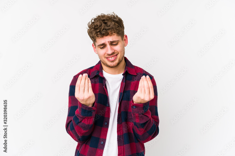 Young blond curly hair caucasian man isolated showing that she has no money. Young blond curly hair caucasian man isolated showing that she has no money.