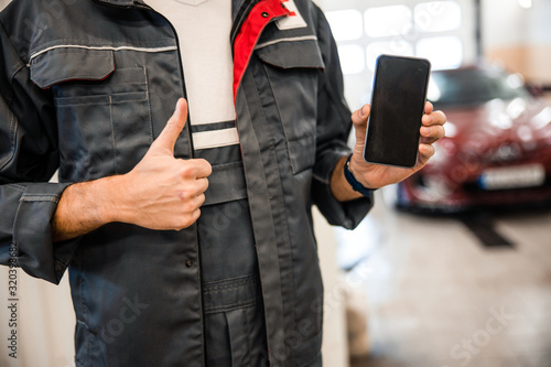 Young man bragging about his mobile phone