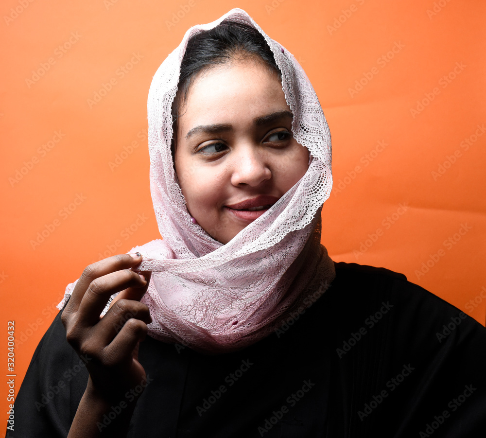 Portrait of arabic woman with traditional abaya dress in a studio Portrait of arabic woman with traditional abaya dress in a studio
