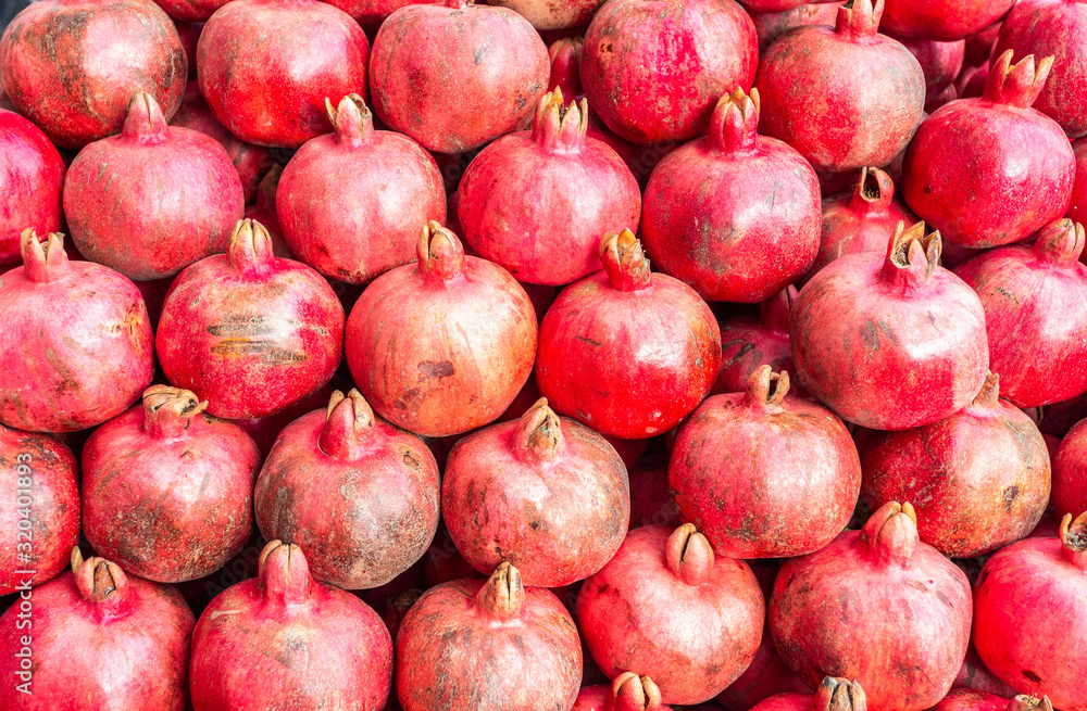 Background from red fresh pomegranate fruits Background from red fresh pomegranate fruits