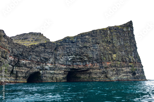 Steep coastline with vertical cliff and caves