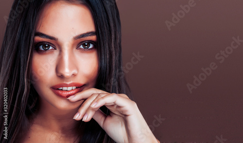 cute happy young indian woman in studio close up smiling, fashion beauty