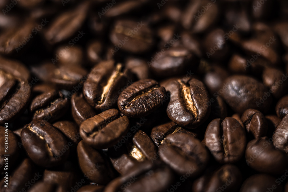 Fototapeta premium Macro image of coffee beans, small depth of field, selective focus